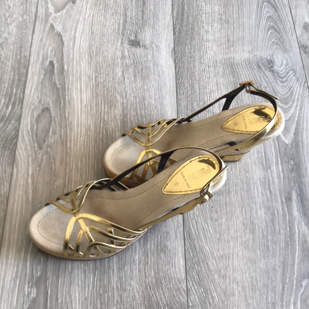 Fendi platforms. Gold with a gold heel accent.